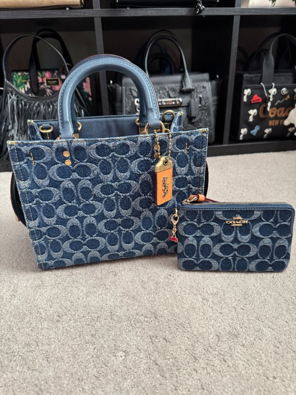 Rogue 25 in Signature Denim with matching wristlet, both NWT